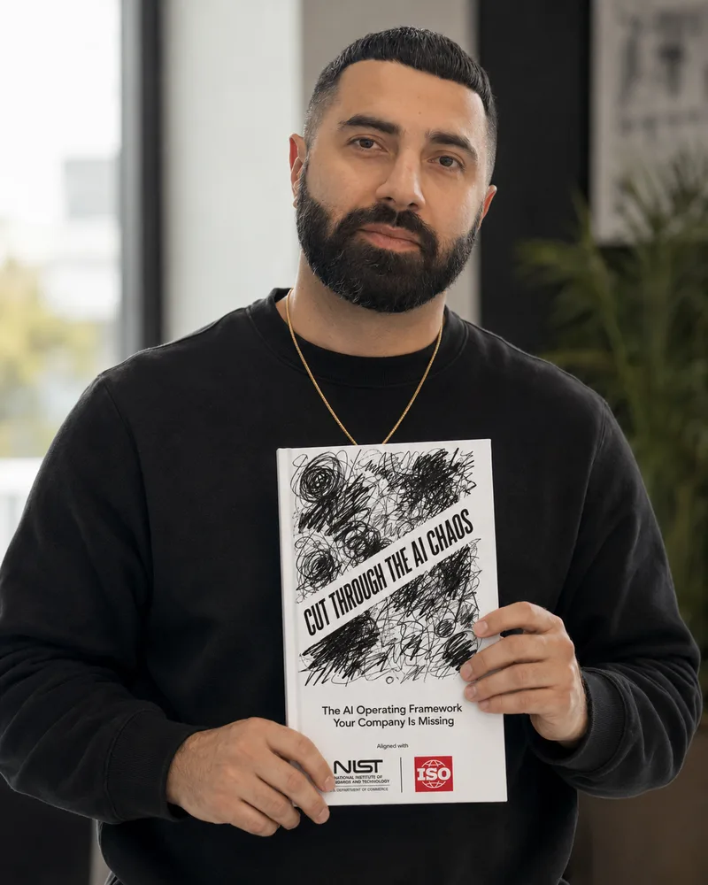 Sepi Madani holding the book Cut Through the AI Chaos